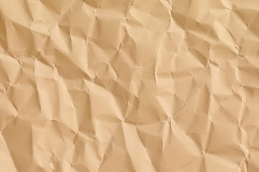 Brown crumpled paper texture. Abstract brown recycled paper background