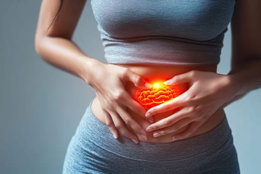 Woman holding her stomach with her hands in pain. Intestinal inflammation. Stomach pain and digestive problems, gastritis or diarrhea.