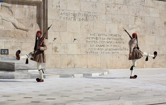 ATHENS, GREECE - SEPTEMBER 09, 2015: Special unit of the Hellenic Army, known as The Evzones, who guard the Monument of the Unknown Soldier in front of the Hellenic Parliament. Changing of the guard.