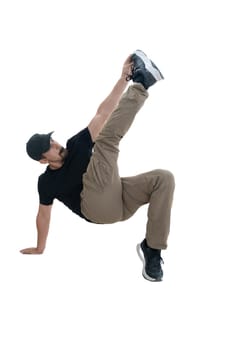 A talented dancer is showcasing a skillful and dynamic move against a clean, minimalist background setting