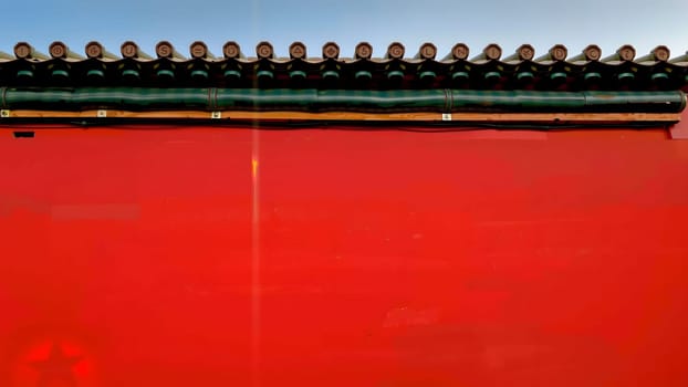 The Chinese old style window on bright red wall with nice sky