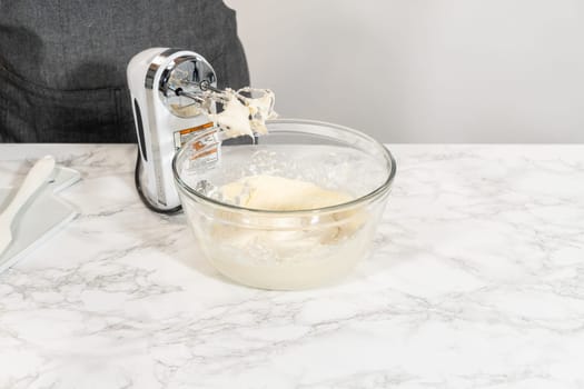Creating a delectable treat, the process of making homemade cream cheese frosting involves whisking together creamy ingredients to achieve the perfect texture and taste.