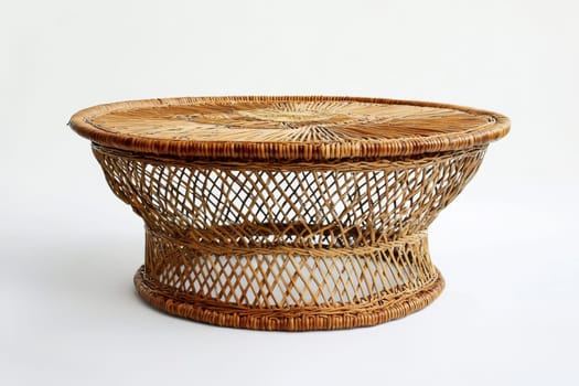 A round rattan table highlights detailed weaving patterns and a sturdy base, perfect for adding natural charm to any space.