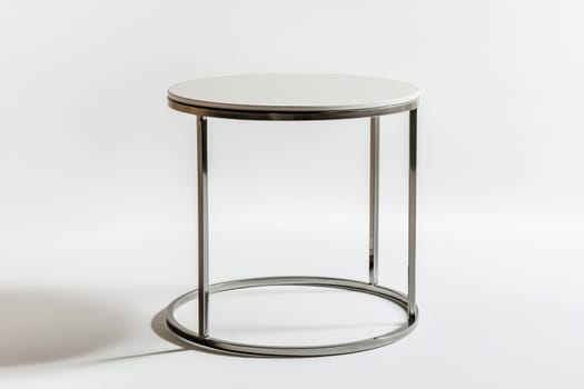 This stylish round side table features a sleek metal frame and a clean white top, perfect for enhancing any modern living space.