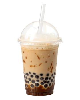 Iced coconut milk bubble tea with chewy tapioca pearls and caramel drizzle in a plastic cup with a straw. Creamy and refreshing Asian drink. Isolated on white background.