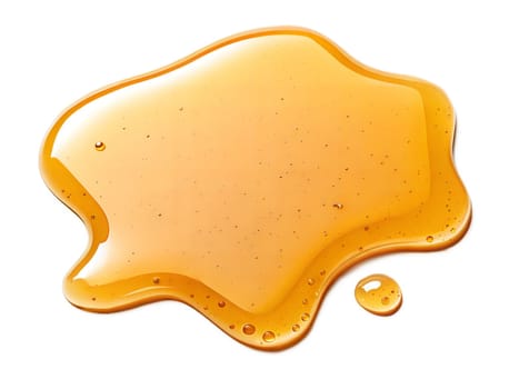 Golden honey splash with glossy texture and scattered droplets. Perfect for food, sweet, or natural design concepts. Isolated on white background.