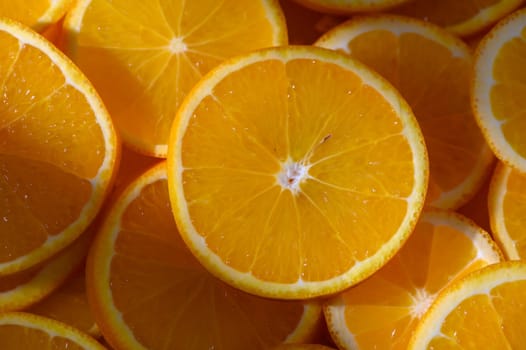 Juicy orange slices create a colorful tapestry, celebrating nature's bounty with a refreshing summer essence.