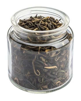 Dried oolong tea leaves stored in a transparent glass jar with a sealed lid. Traditional loose leaf tea for brewing. Isolated on white background