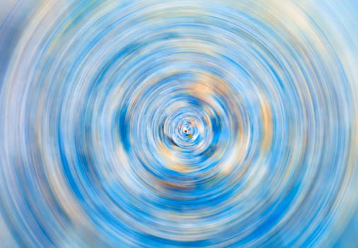 Frosty circular motion blur, abstract background in blue and yellow tones