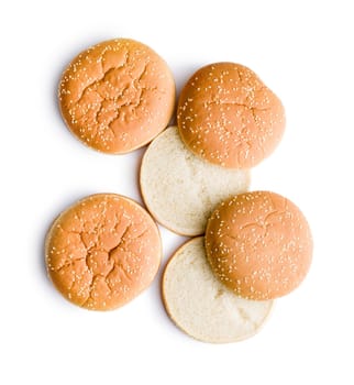 Empty burger bun with sesame seeds isolated on a white background.