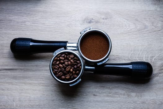 a cup of coffee a coffee horn with natural ground coffee and temper on a white background close-up, selective focus