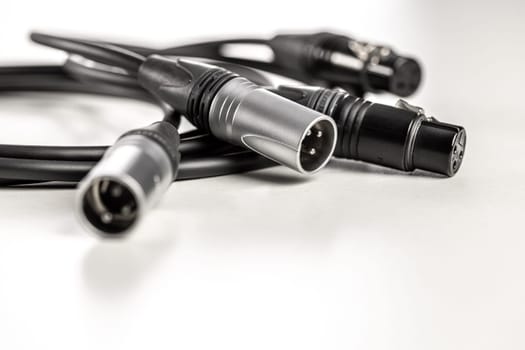 Xlr audio cables connecting on white background
