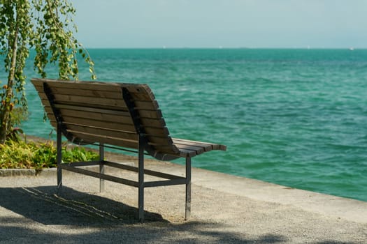 Idyllically situated bench on the island of Mainau on the shores of Lake Constance in Germany
