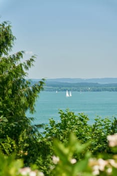 View of Lake Constance, Bodensee from the island of Mainau in Germany with some sailing boats