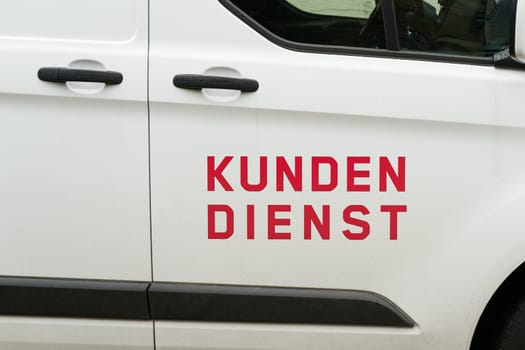 Delivery van of a service provider with the German inscription Kundendienst. Translation: Customer service