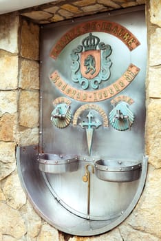 Pilgrims on the Camino de Santiago enjoy free wine from Fuente del Vino, a refreshing stop along their journey.