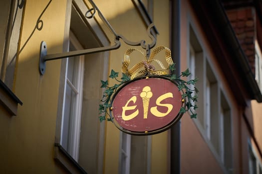 Sign with the German inscription Eis in the old town of Rothenburg ob der Tauber. Translation: Ice cream