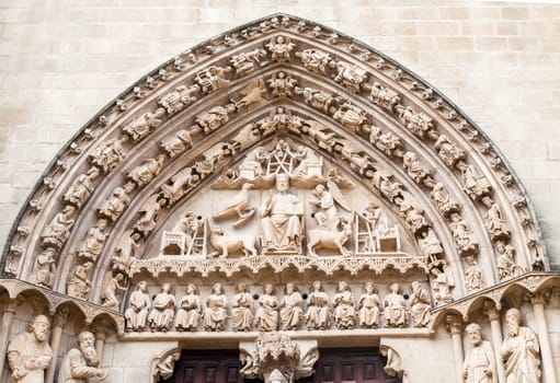 Detailed stone facade of the Cathedral in Burgos, Spain, with its gothic artwork.