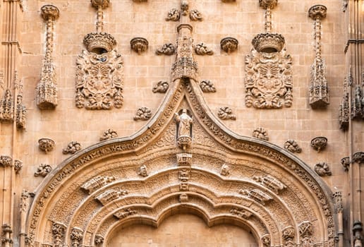 Elaborate stone details decorate the entrance of the cathedral in Salamanca, showcasing the city's rich history and craftsmanship.