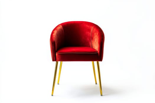 A plush red velvet chair featuring golden legs is showcased against a bright white backdrop, highlighting its striking design.