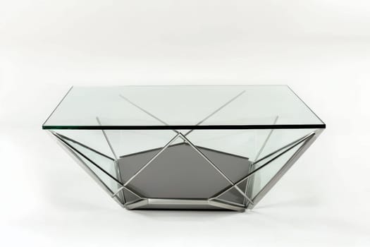 This coffee table showcases a sleek glass top supported by a unique metal base, ideal for modern living spaces and stylish decor.