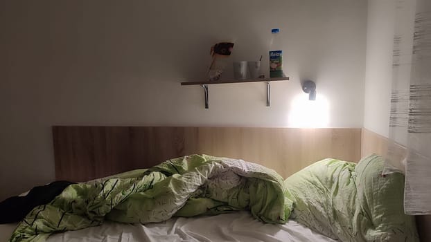 October 16 2024 Decin Czech Republic Europe travel places. Disorganized bed shelf room apartment hotel interior design decor furniture . High quality photo