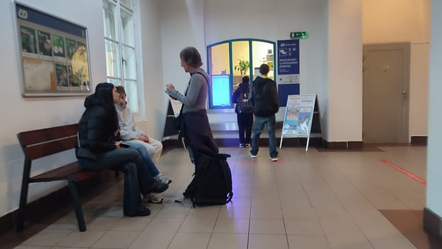 October 16 2024 Decin Czech Republic Europe. Travel transport station train bus hallway conversation. Indoor people womens . High quality photo