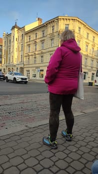 October 16 2024 Decin Czech Republic Europe . Woman city street outdoor autumn building architecture travel people tourism fashion clothing . High quality photo