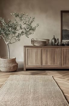 A stylish interior featuring a wooden cabinet, woven baskets, an olive tree, and a textured rug on a hardwood floor.