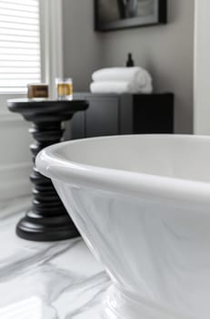 A spacious bathroom features a freestanding tub, stylish decor, and smooth marble flooring, creating a relaxing atmosphere for relaxation.