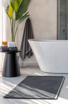 This stylish bathroom features a freestanding tub, a sleek black table, and decorative plants, creating a serene atmosphere for relaxation.