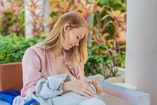A mother breastfeeds her baby in a cozy cafe, embracing a natural and nurturing moment amidst a casual, public setting. This intimate scene reflects modern parenting, maternal love, and the beauty of everyday life.