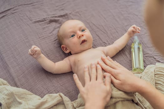 A mother gently massages her 1-month-old baby with baby oil after a bath. This tender moment highlights the bond between parent and child, promoting relaxation, baby care, and the importance of skin-to-skin contact.