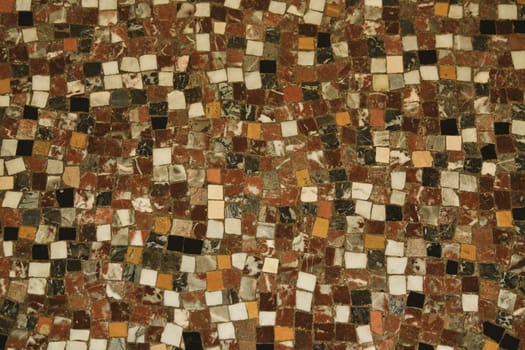 Small antique cracked brown beige white black mosaic tiles pattern background abstract pattern background