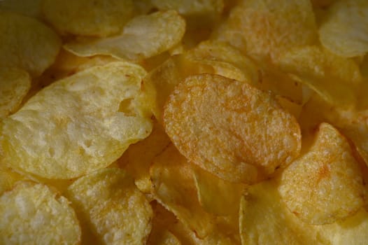 Crispy potato chips spread out in a colorful display, inviting a delightful snacking experience for all.