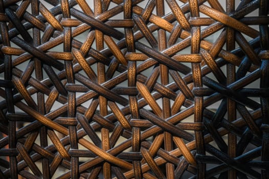 Stunning details of a handcrafted weaving display an artful blend of warm browns and blacks in the composition.