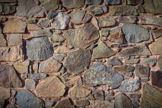 The stone arrangement on the surface showcases a rich history and artistic human craftsmanship.