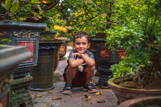 Portrait of a happy caucasian schoolboy kid boy on a park in summer