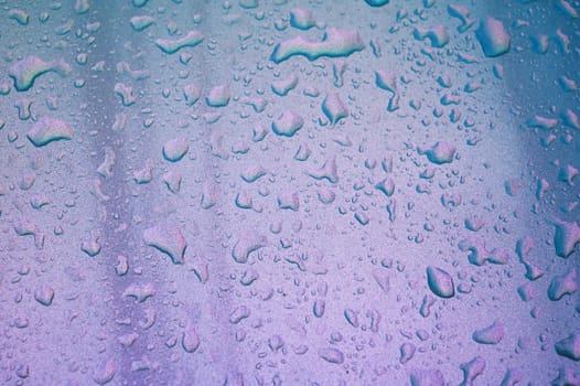 abstract pearl background with texture of rain drops on a metal surface close-up