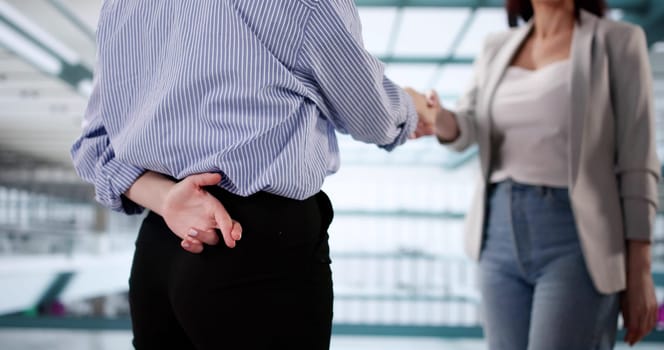 The Deceitful Businesswoman: Crossed Fingers and Broken Contracts