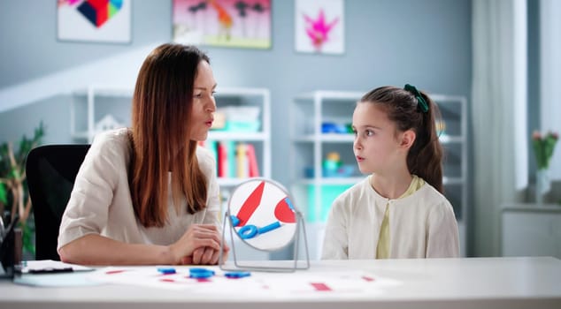 Helping young children learn to speak with a speech therapist.