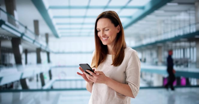 Multicultural office worker reading financial advice online on smartphone