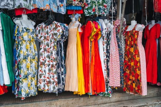 female multicolored dresses at the East Asian street market