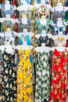 women's colorful summer dresses on mannequins are sold on the market in Asia