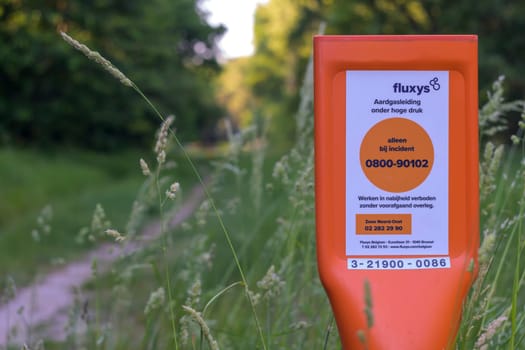 Kapellen, Belgium, June 2023: Fluxys natural gas pipeline indication in the nature of Antwerp North region