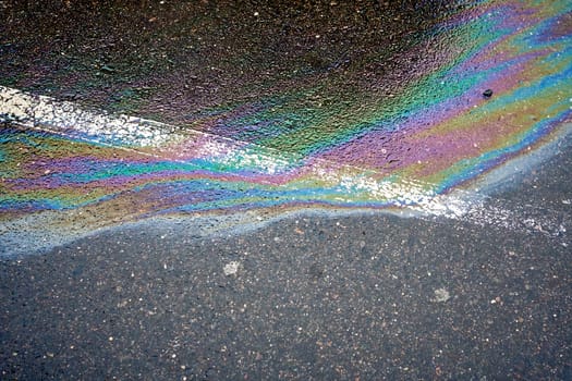 Automobile Oil and Gas Stains on Asphalt Parking Lot.