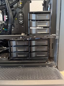 Castle Rock, Colorado, USA-August 18, 2024-A custom built gaming PC with an open side panel revealing internal components The build features a Radeon graphics card liquid cooling system multiple storage bays and a high performance power supply The black case has ample ventilation and cable management for optimal airflow Ideal for gaming enthusiasts and PC builders
