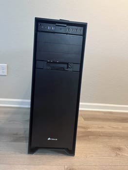 Castle Rock, Colorado, USA-August 18, 2024-A custom built gaming PC with an open side panel revealing internal components The build features a Radeon graphics card liquid cooling system multiple storage bays and a high performance power supply The black case has ample ventilation and cable management for optimal airflow Ideal for gaming enthusiasts and PC builders