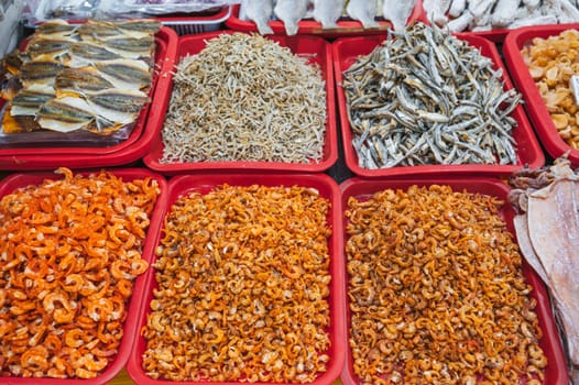 assortment of dried fish and dried shrimp on the counter at the Asian market