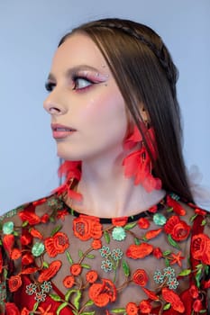 A captivating portrait showcasing bold fashion, intricate floral details, and vibrant makeup artistry